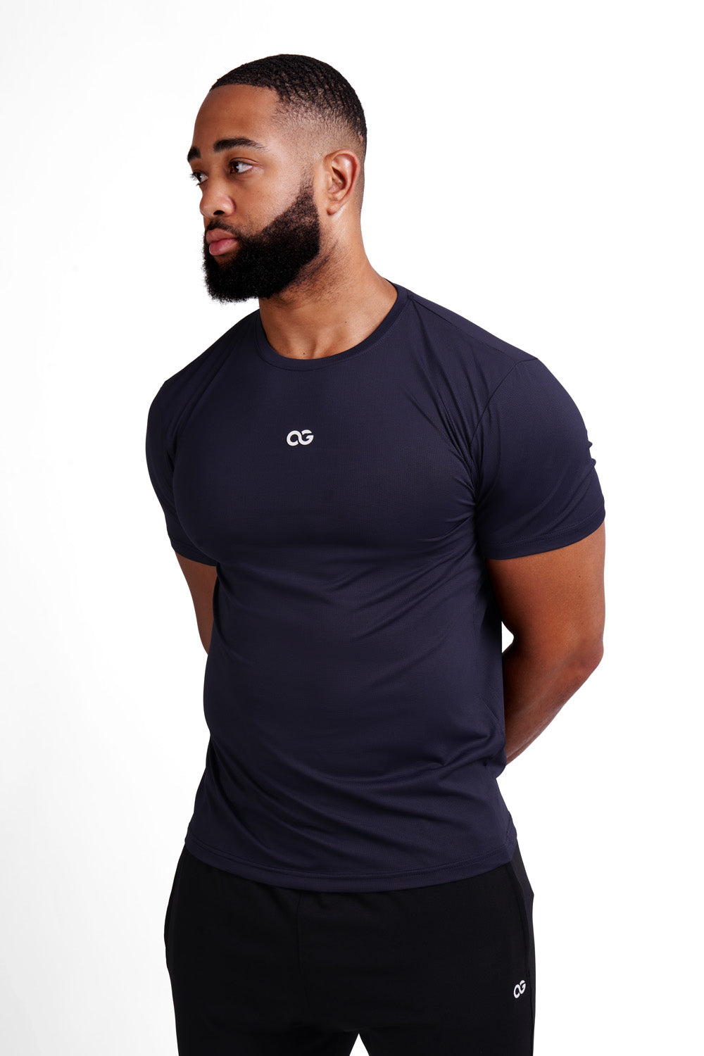OG Men's Premium Performance Tee Black - Side view, muscle fit, white OG logo on chest - Original Greatness