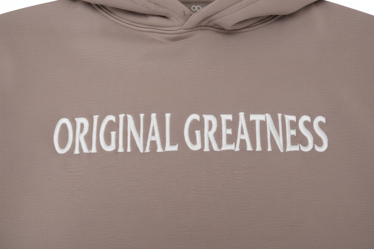 OG Essential Hoodie sand - OG logo close-up embroidery detail on chest - Original Greatness